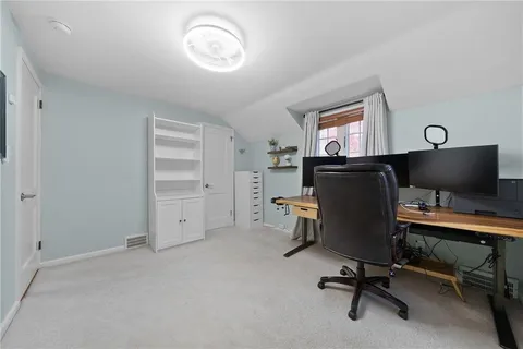 a bathroom with a toilet and a shower curtain