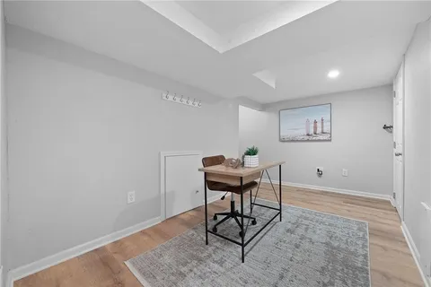a white toilet sitting next to a bathroom sink