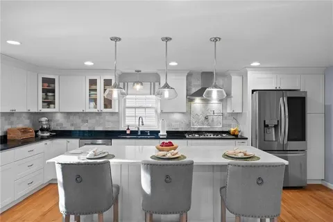 a kitchen with counter space cabinets and appliances