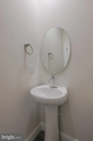 a bathroom with a sink a mirror and vanity