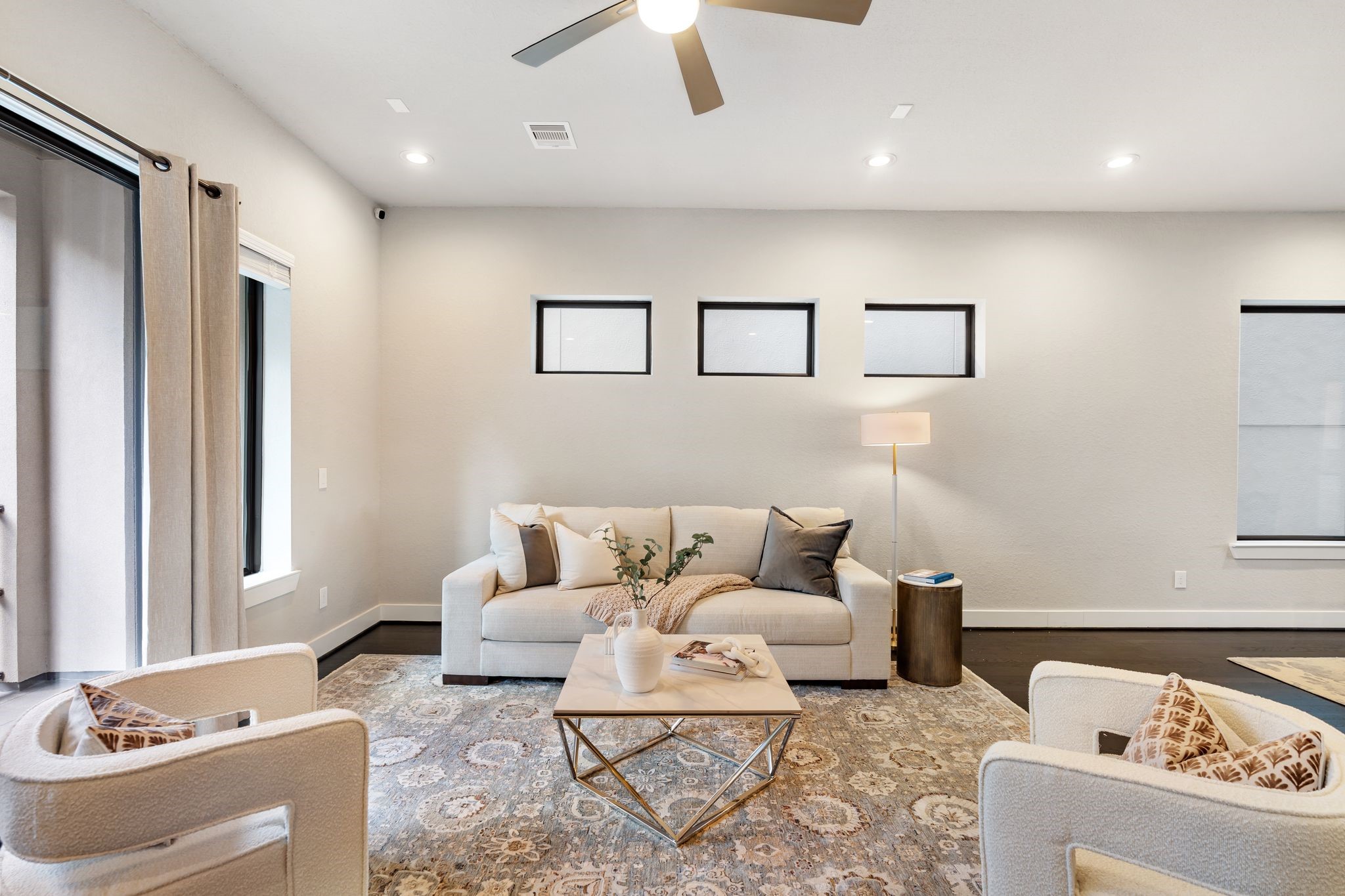 4219 Allen Street Houston, TX 77007 - Photo 12 of 29 a living room with furniture and a couch