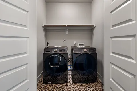 a bathroom with a sink mirror toilet and bathtub