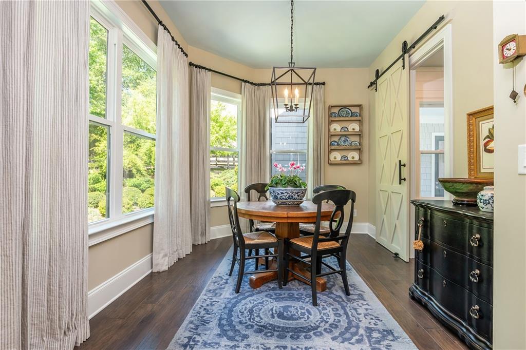 135 Milestone Trail Milton, GA 30004 - Photo 36 of 88 a view of a dining room with furniture window and wooden floor