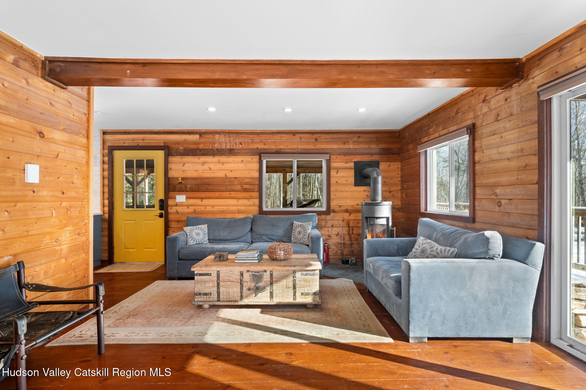 153 Slater Road Windham, NY 12454 - Photo 11 of 38 a living room with furniture and a large window