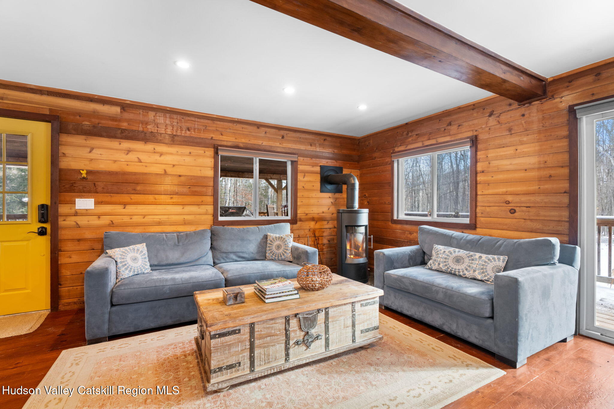 153 Slater Road Windham, NY 12454 - Photo 12 of 38 a living room with furniture and a large window