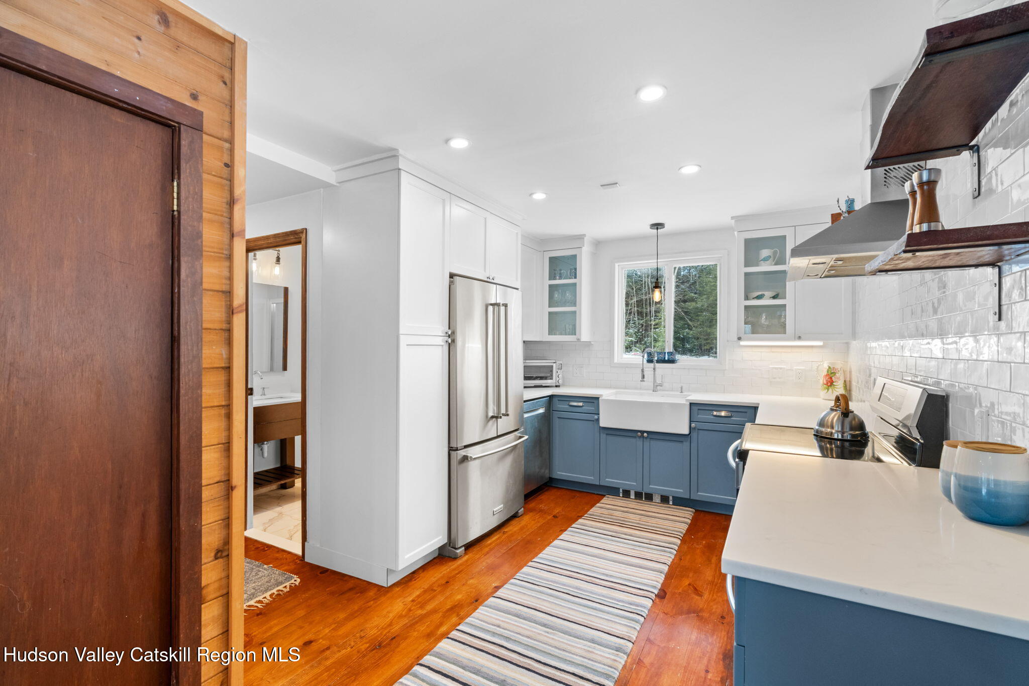 153 Slater Road Windham, NY 12454 - Photo 15 of 38 a kitchen with a refrigerator and a sink