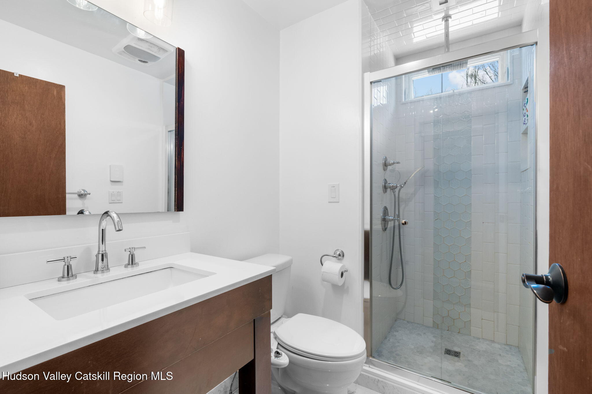 153 Slater Road Windham, NY 12454 - Photo 16 of 38 a bathroom with a sink a toilet and shower