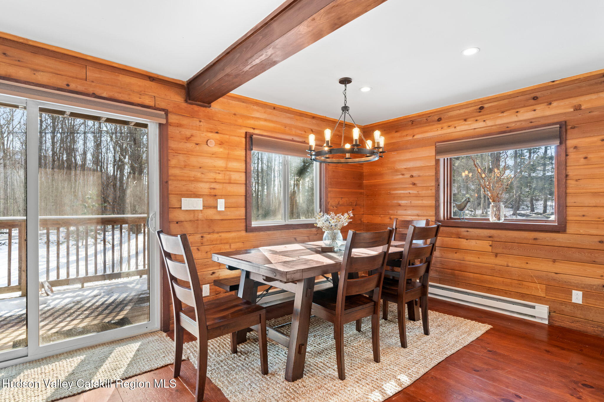 153 Slater Road Windham, NY 12454 - Photo 20 of 38 a view of a dining room with furniture window and wooden floor