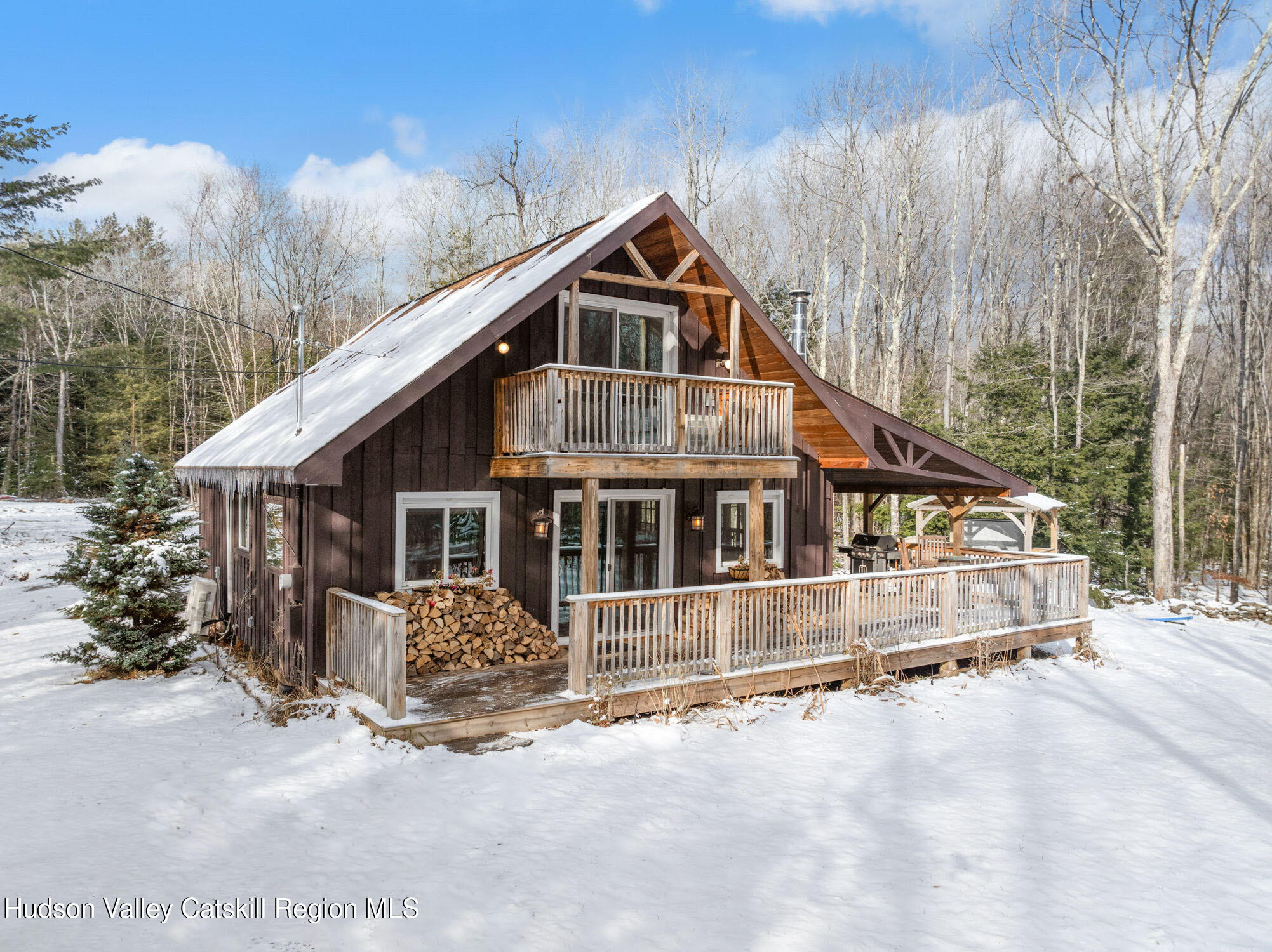 153 Slater Road Windham, NY 12454 - Photo 2 of 38 a view of a house with a yard covered in snow