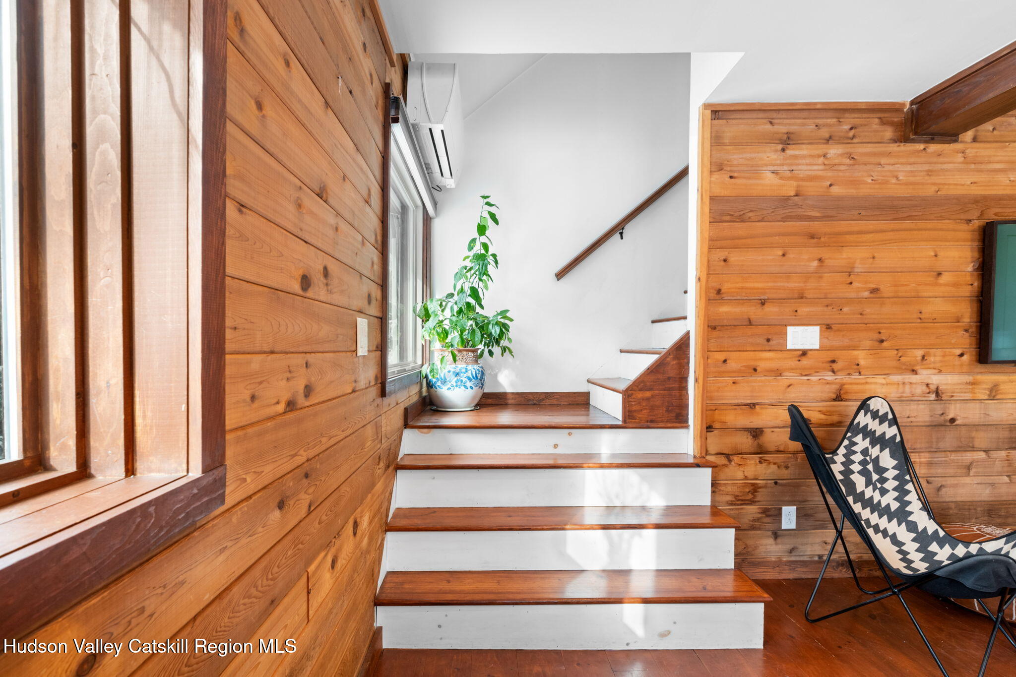 153 Slater Road Windham, NY 12454 - Photo 21 of 38 a view of staircase with wooden floor and a potted plant