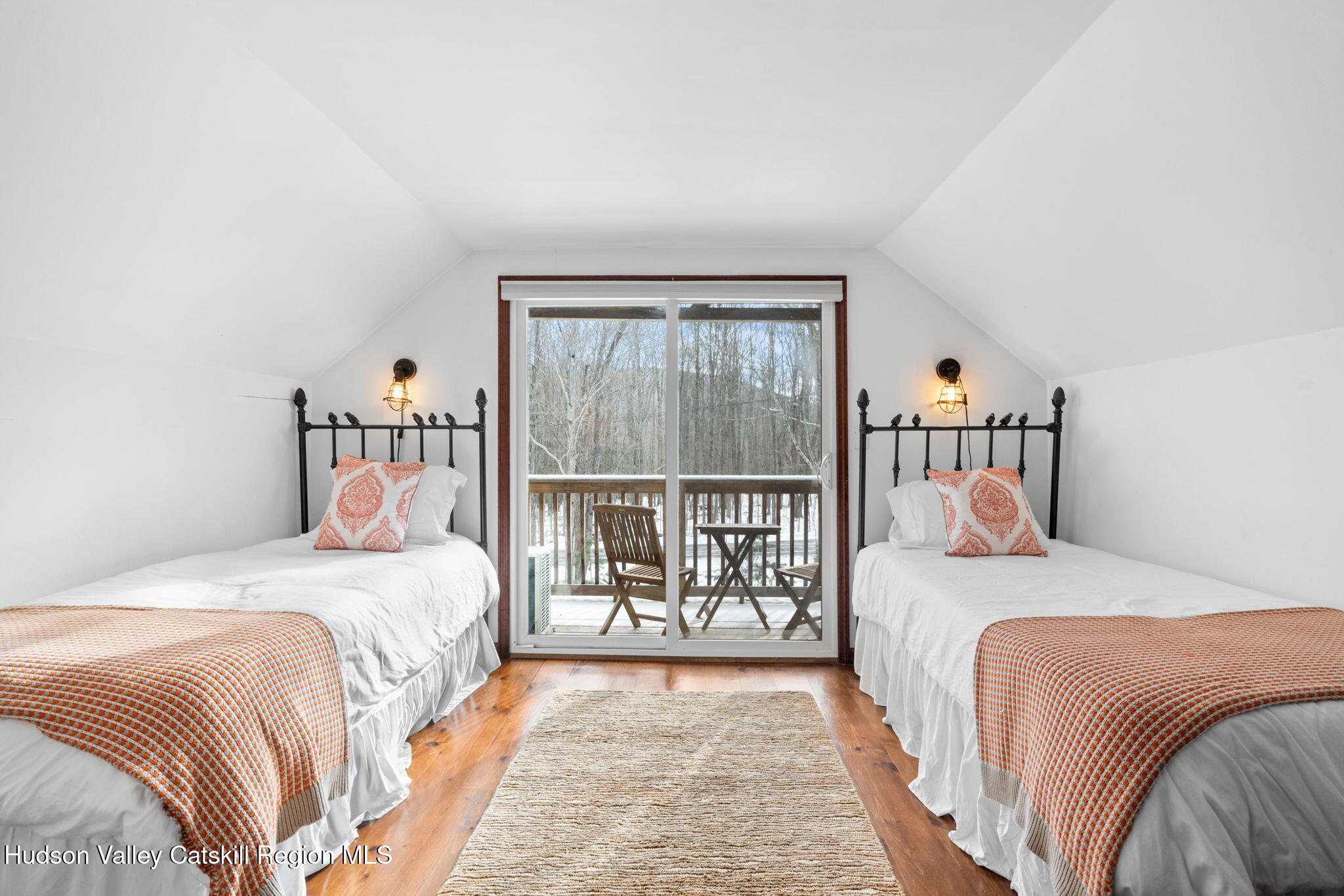 153 Slater Road Windham, NY 12454 - Photo 24 of 38 a bedroom with a bed and a large window