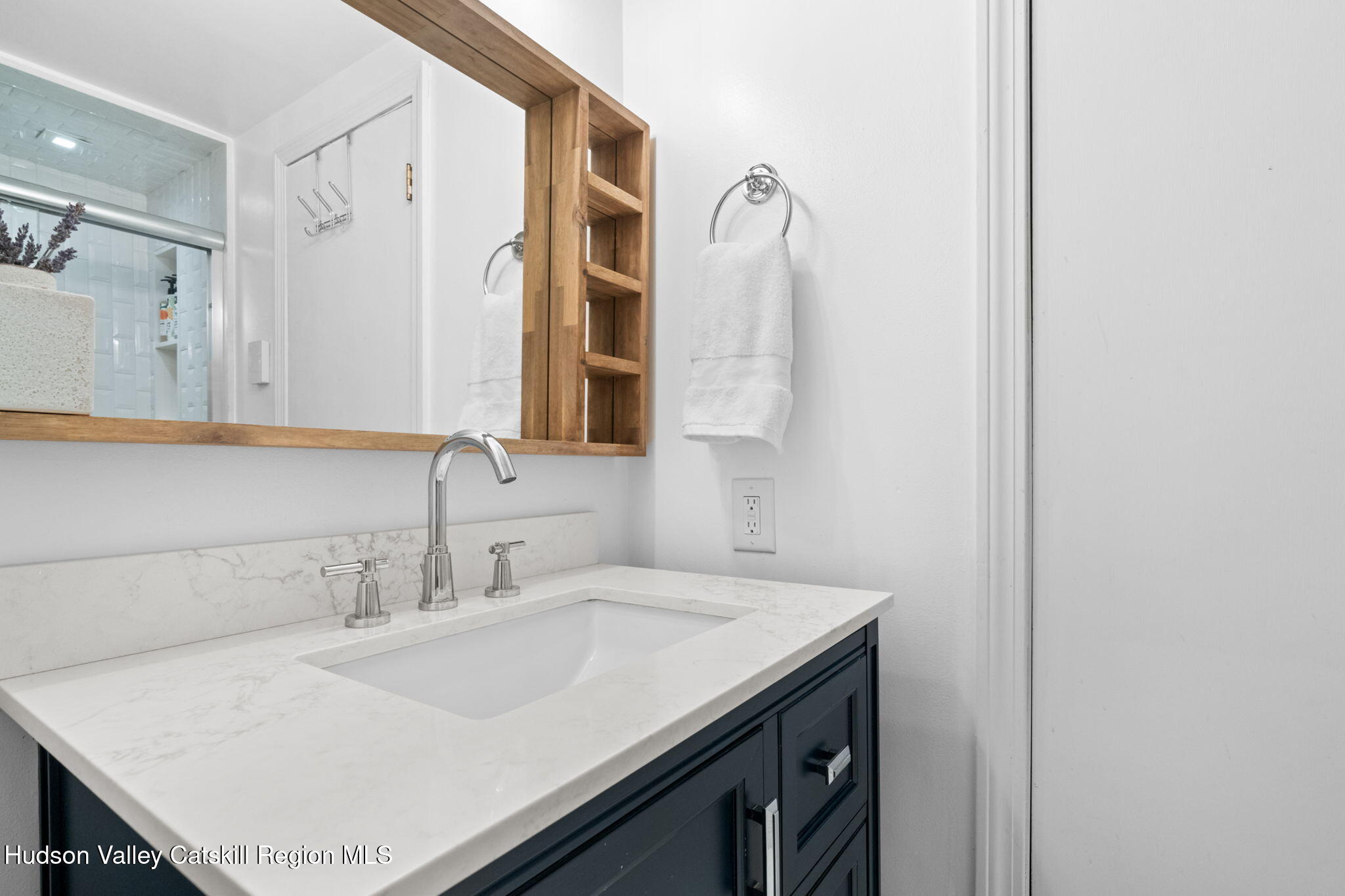 153 Slater Road Windham, NY 12454 - Photo 26 of 38 a bathroom with a sink and a mirror