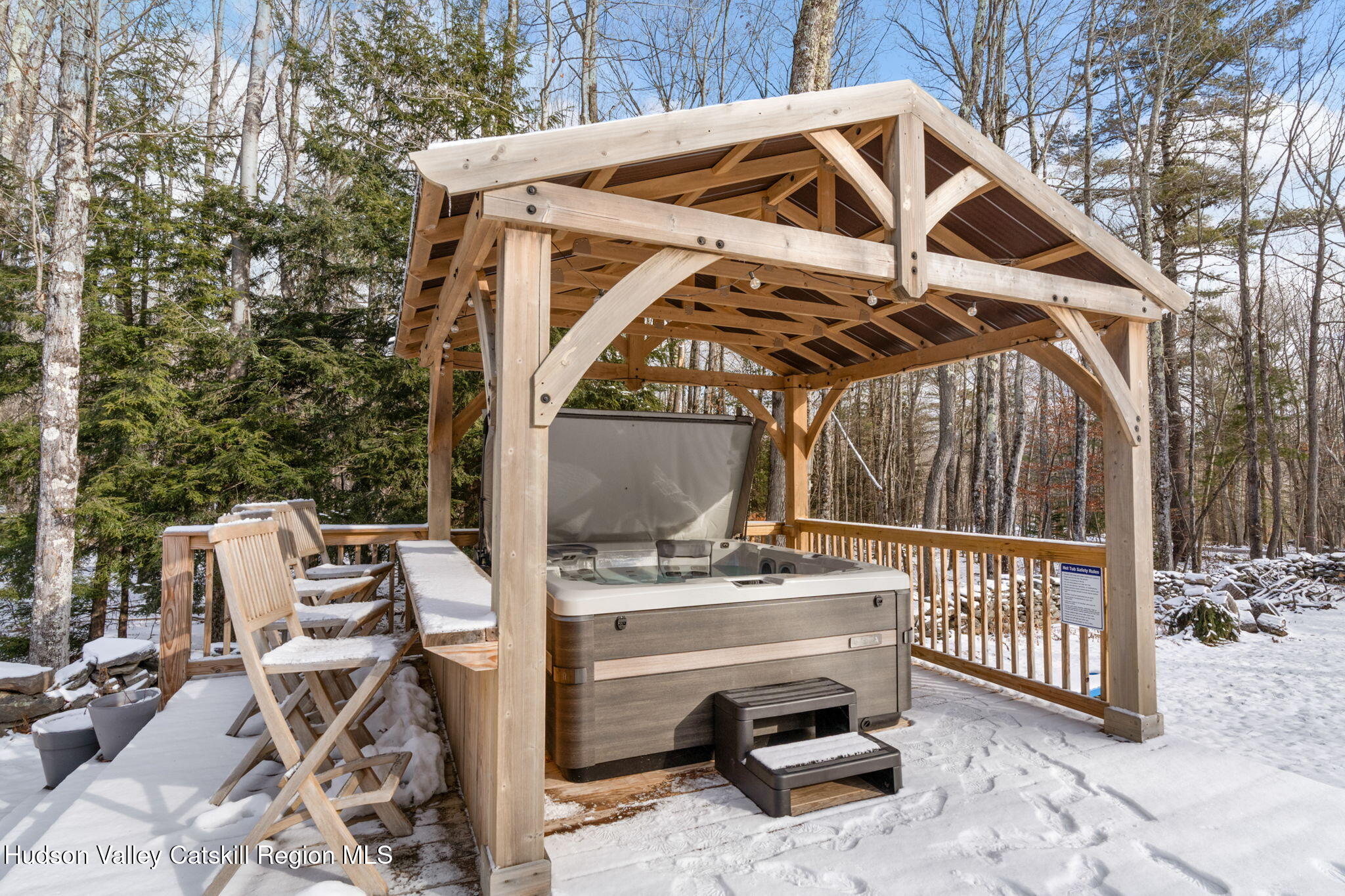 153 Slater Road Windham, NY 12454 - Photo 5 of 38 a view of a patio with a table and chairs