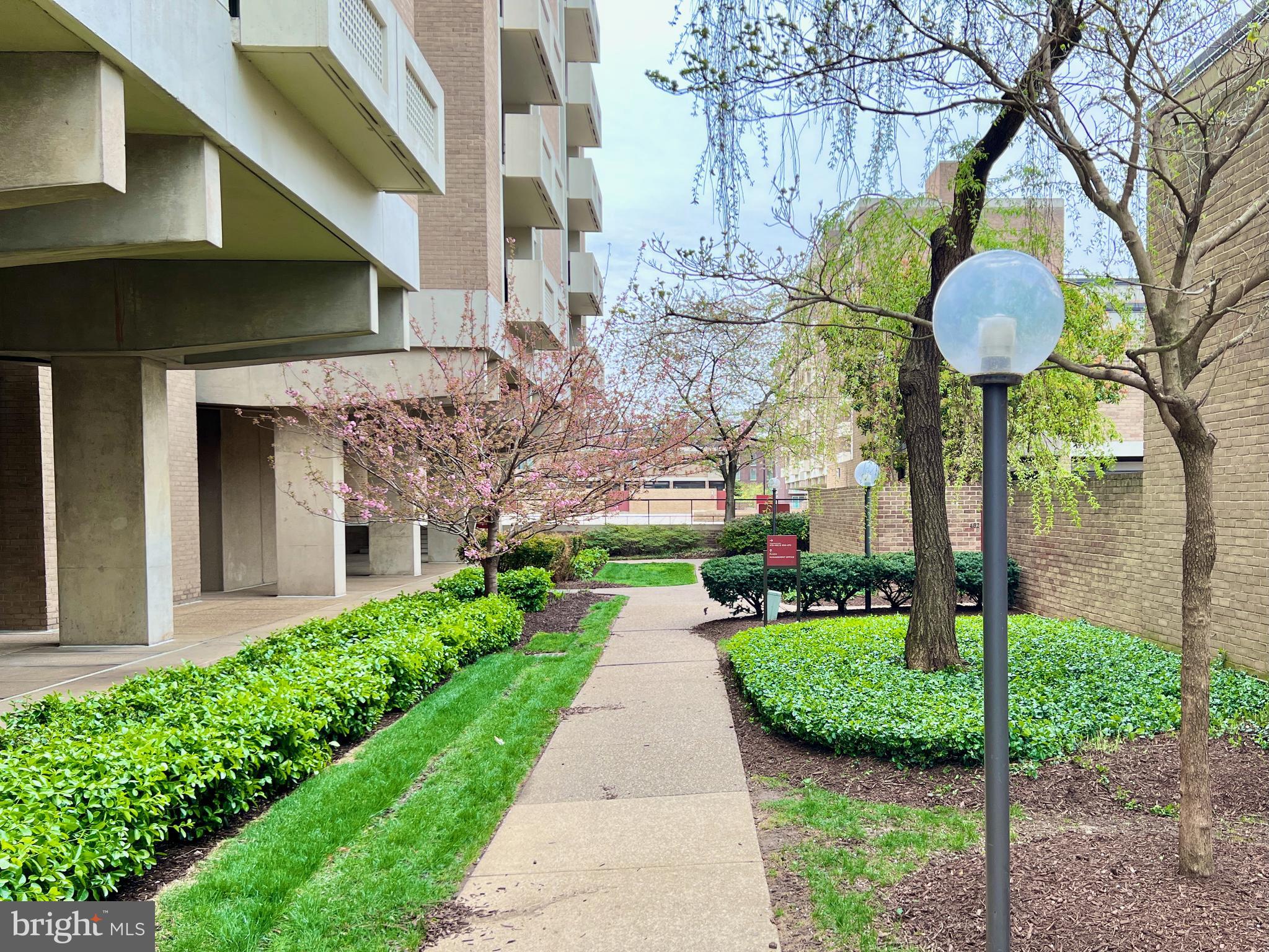 430 M Street Southwest, Unit N502 Washington, DC 20024 - Photo 12 of 27 a front view of a house with garden