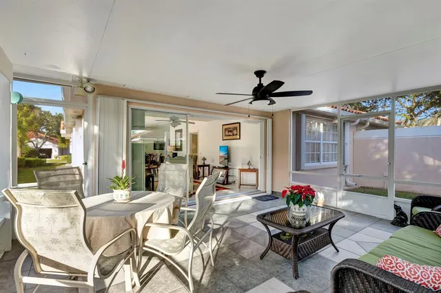 a view of a house with backyard and a garden