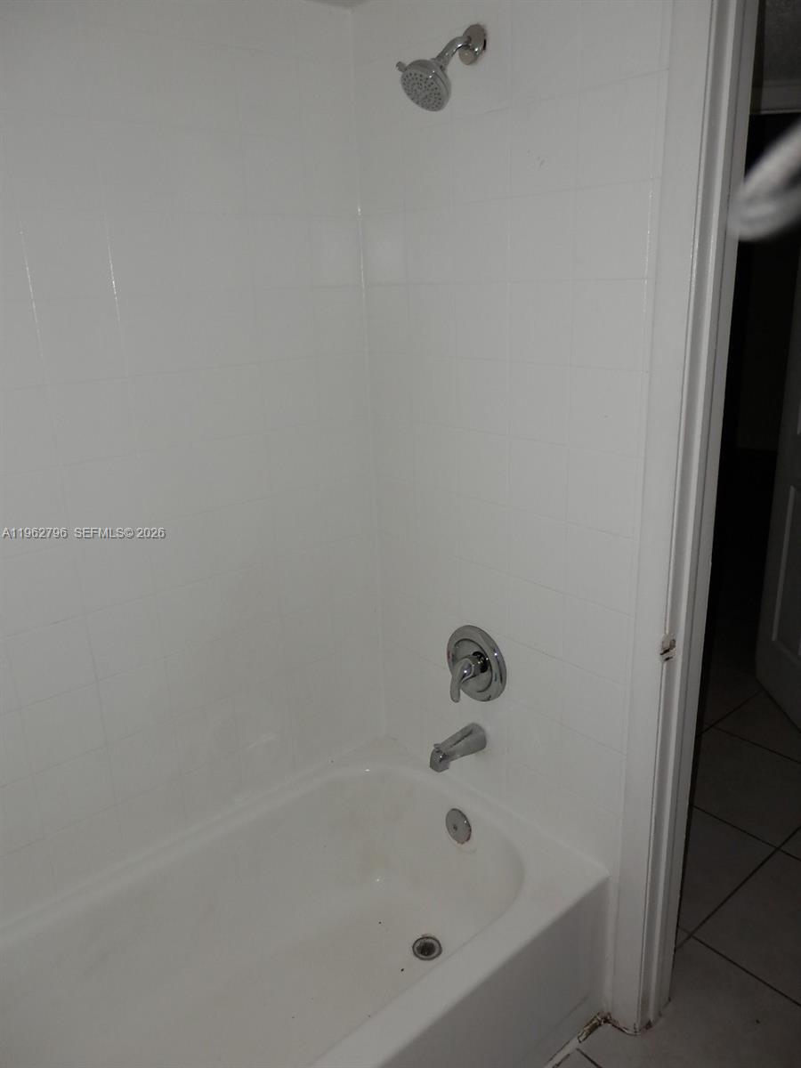 8365 Southwest 152nd Avenue, Unit C116 Miami, FL 33193 - Photo 6 of 8 a bathroom with a bathtub