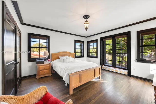 a spacious bedroom with a large bed and a large window