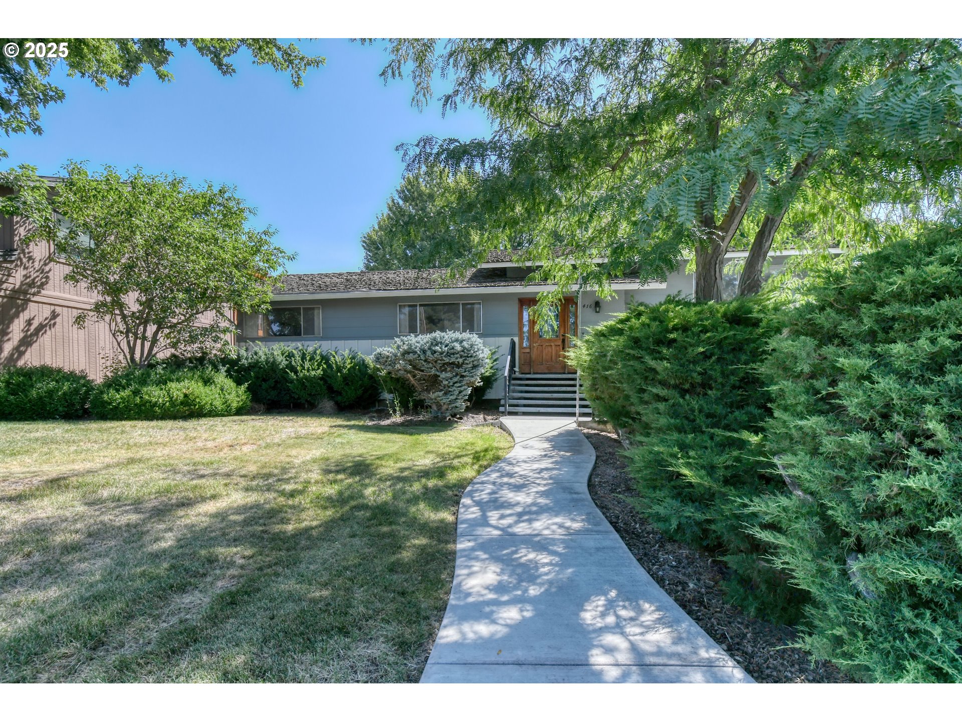a view of backyard with green space