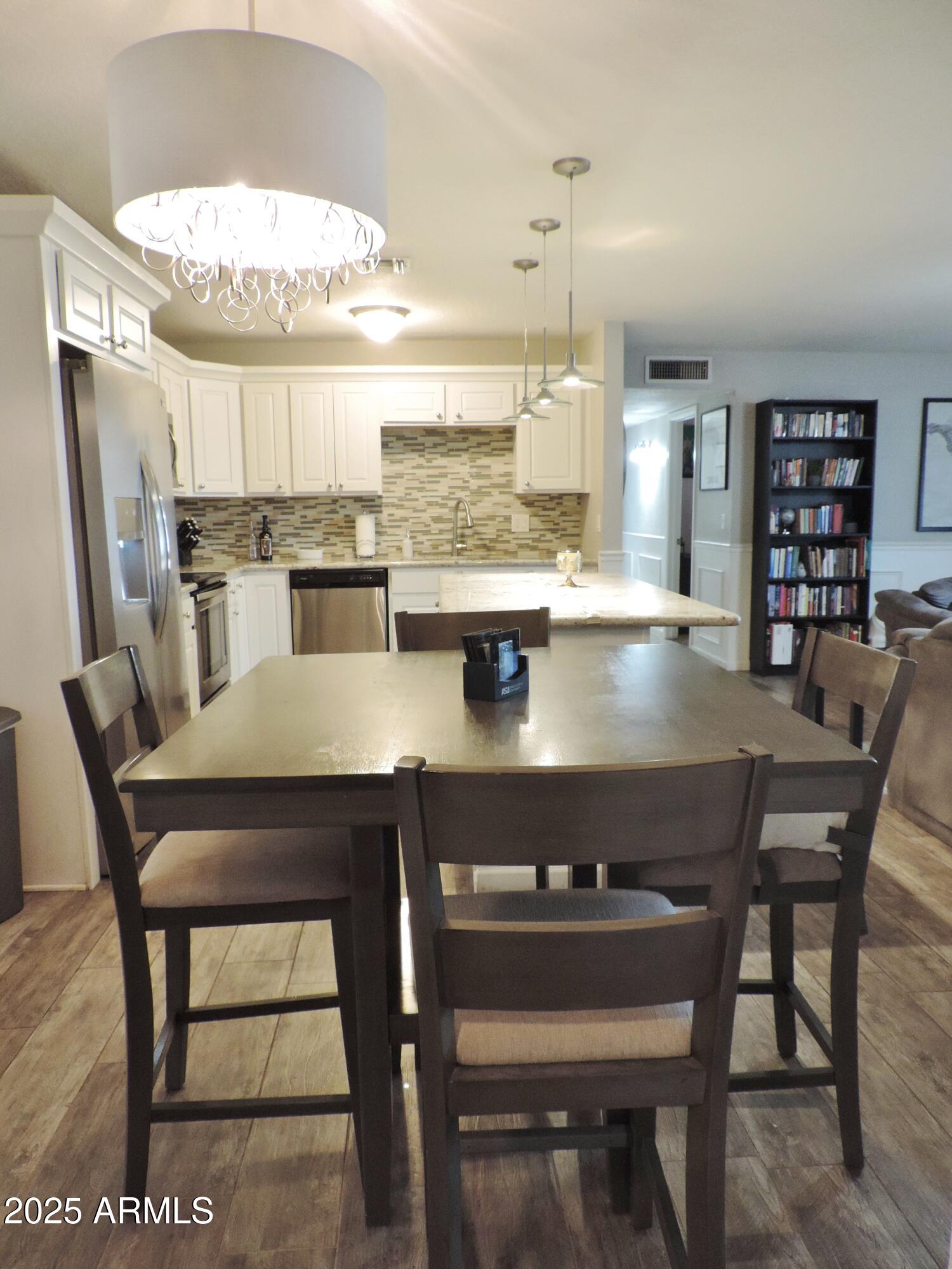 764 North Thunderbird Drive Apache Junction, AZ 85120 - Photo 12 of 74 a view of a dining room with furniture