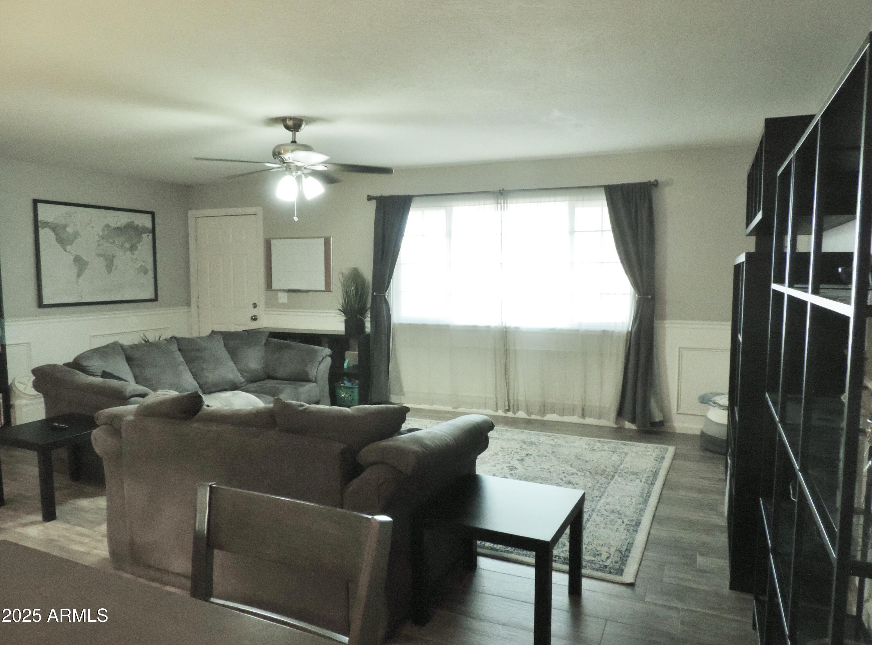 764 North Thunderbird Drive Apache Junction, AZ 85120 - Photo 3 of 74 a living room with furniture and a large window