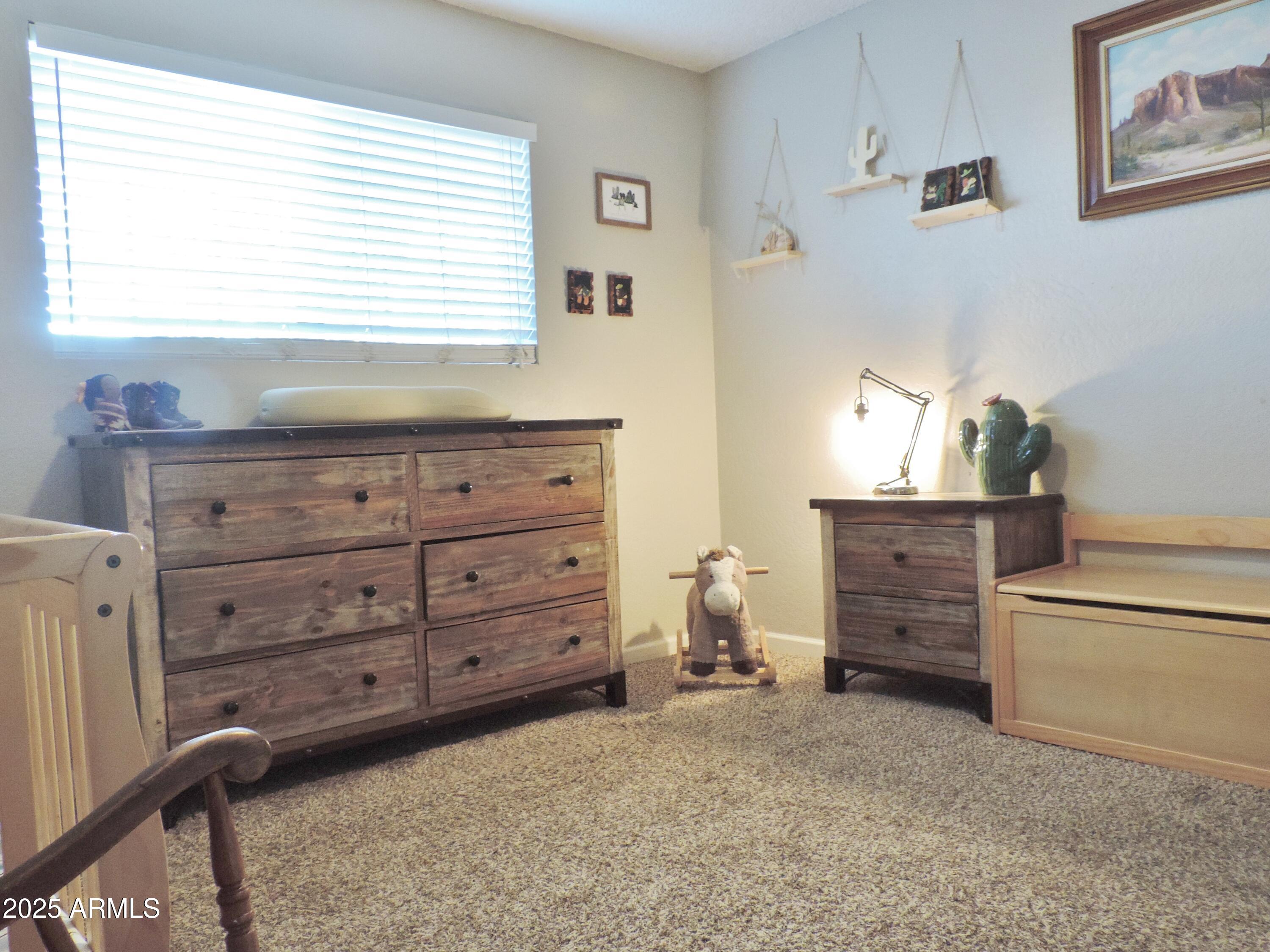 764 North Thunderbird Drive Apache Junction, AZ 85120 - Photo 34 of 74 a room with furniture and a window