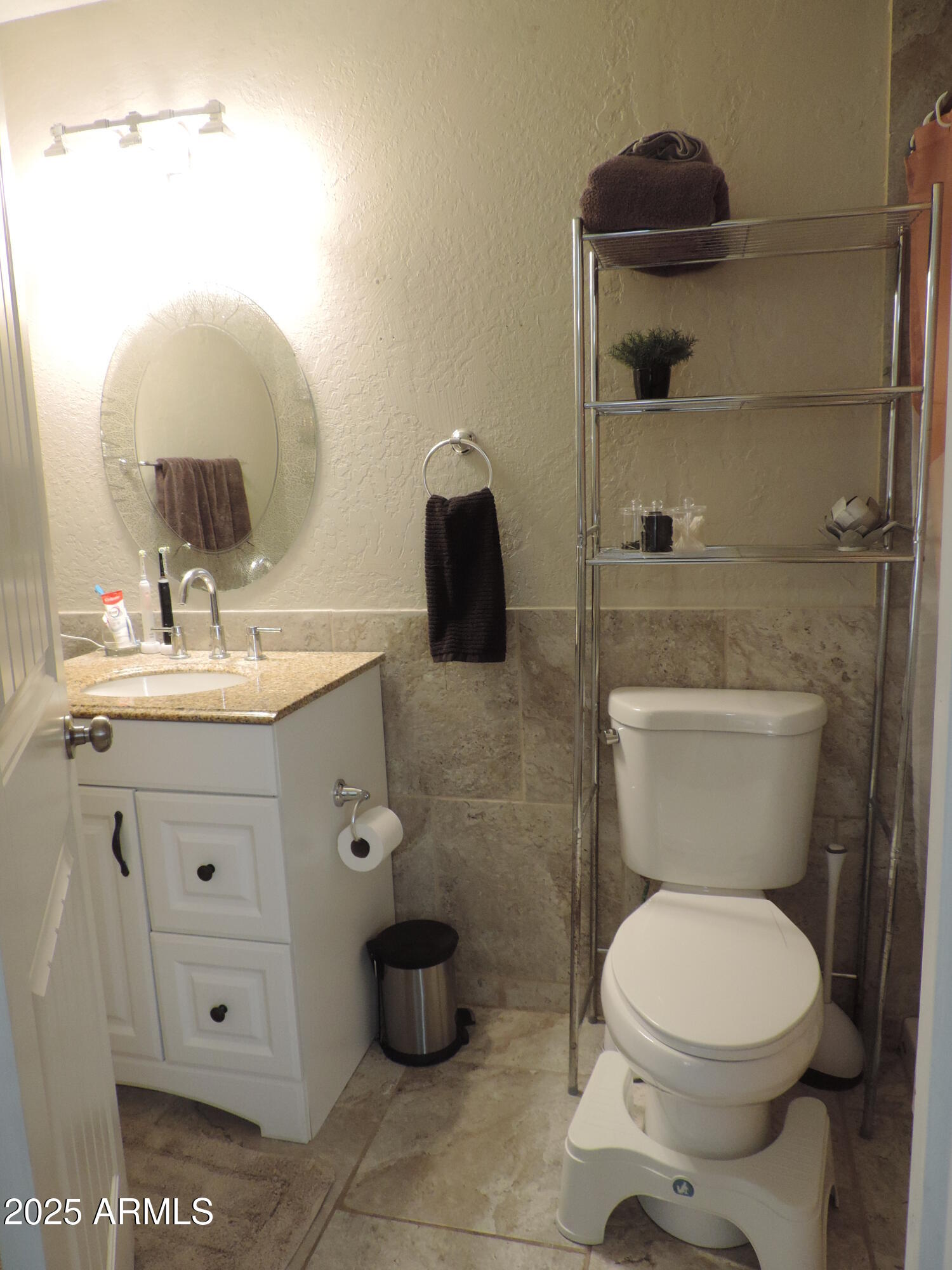 764 North Thunderbird Drive Apache Junction, AZ 85120 - Photo 40 of 74 a bathroom with a toilet sink and mirror