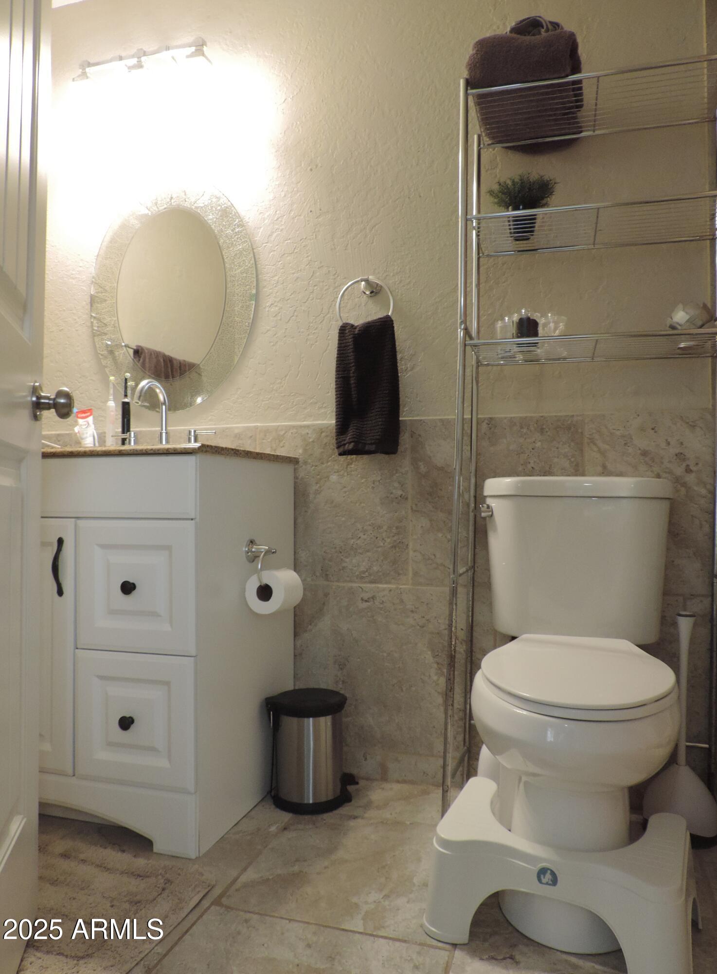 764 North Thunderbird Drive Apache Junction, AZ 85120 - Photo 41 of 74 a bathroom with a toilet and a sink