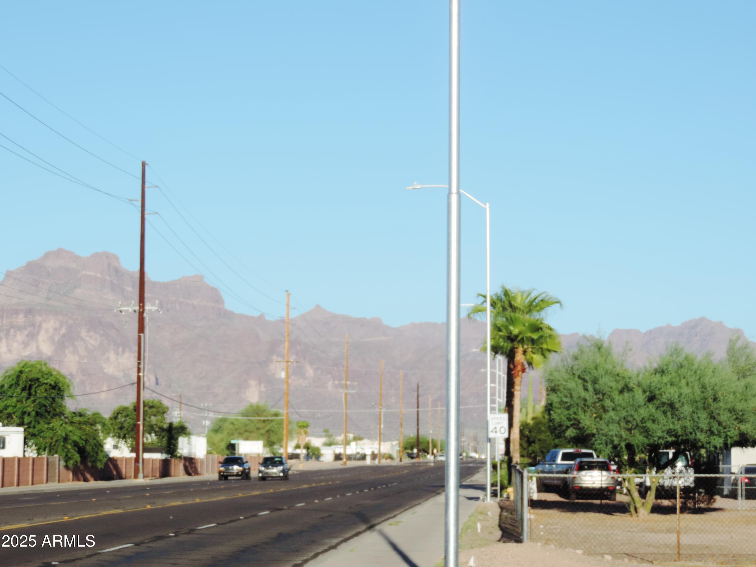 764 North Thunderbird Drive Apache Junction, AZ 85120 - Photo 53 of 74 a city street with a building and a street sign