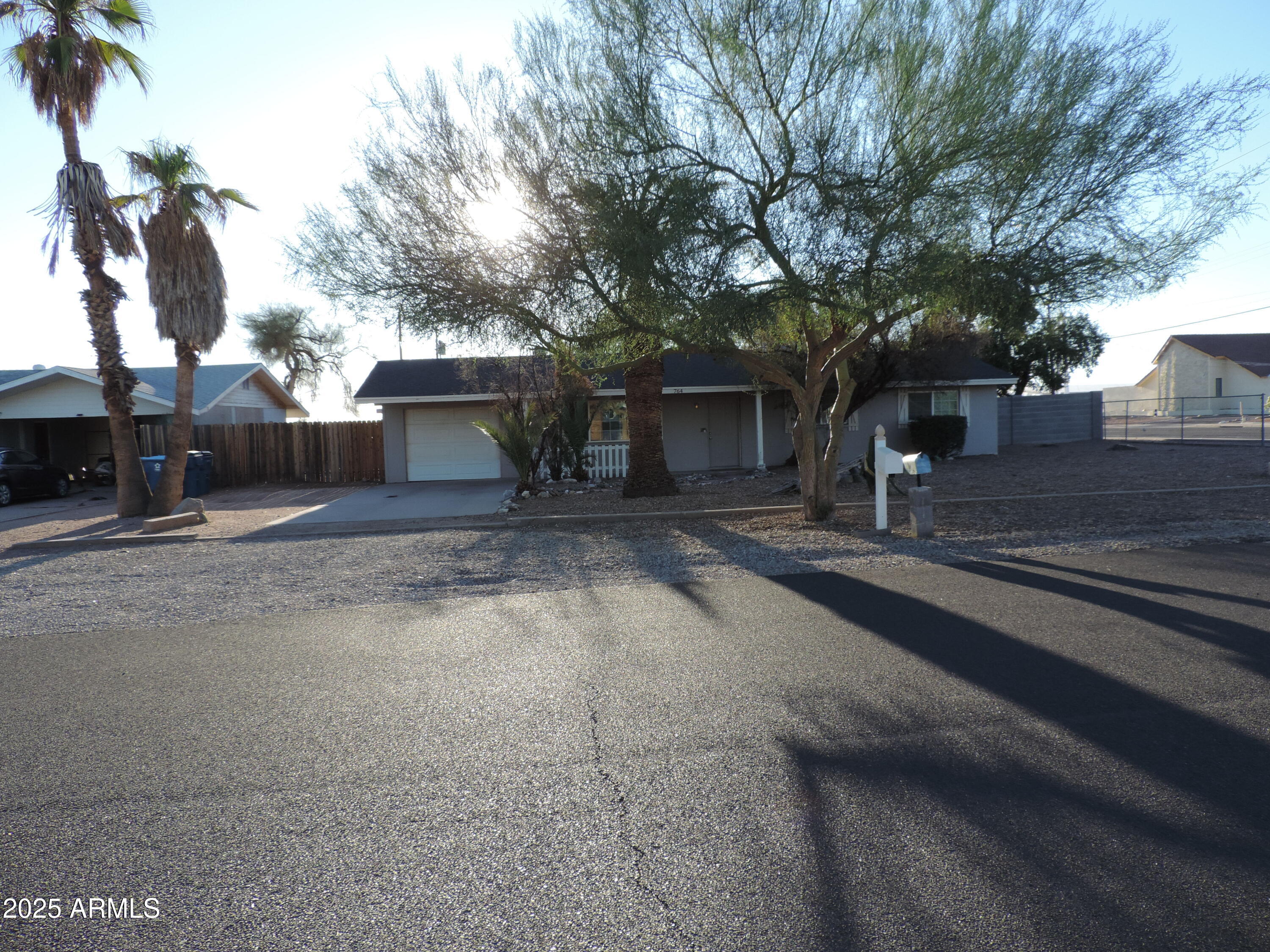 764 North Thunderbird Drive Apache Junction, AZ 85120 - Photo 54 of 74 a front view of a house with a yard