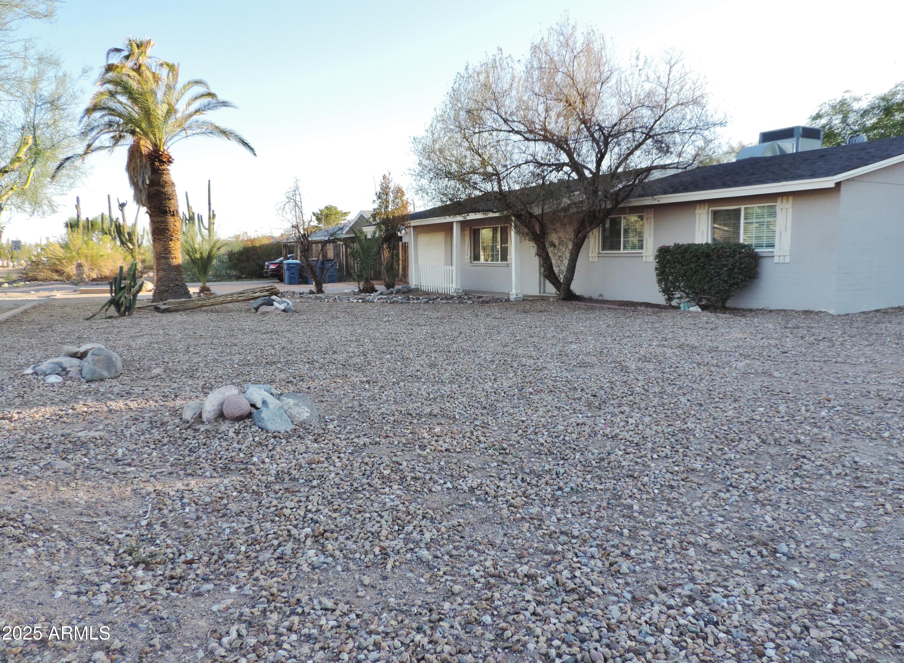764 North Thunderbird Drive Apache Junction, AZ 85120 - Photo 62 of 74 a view of a house with a backyard and a tree