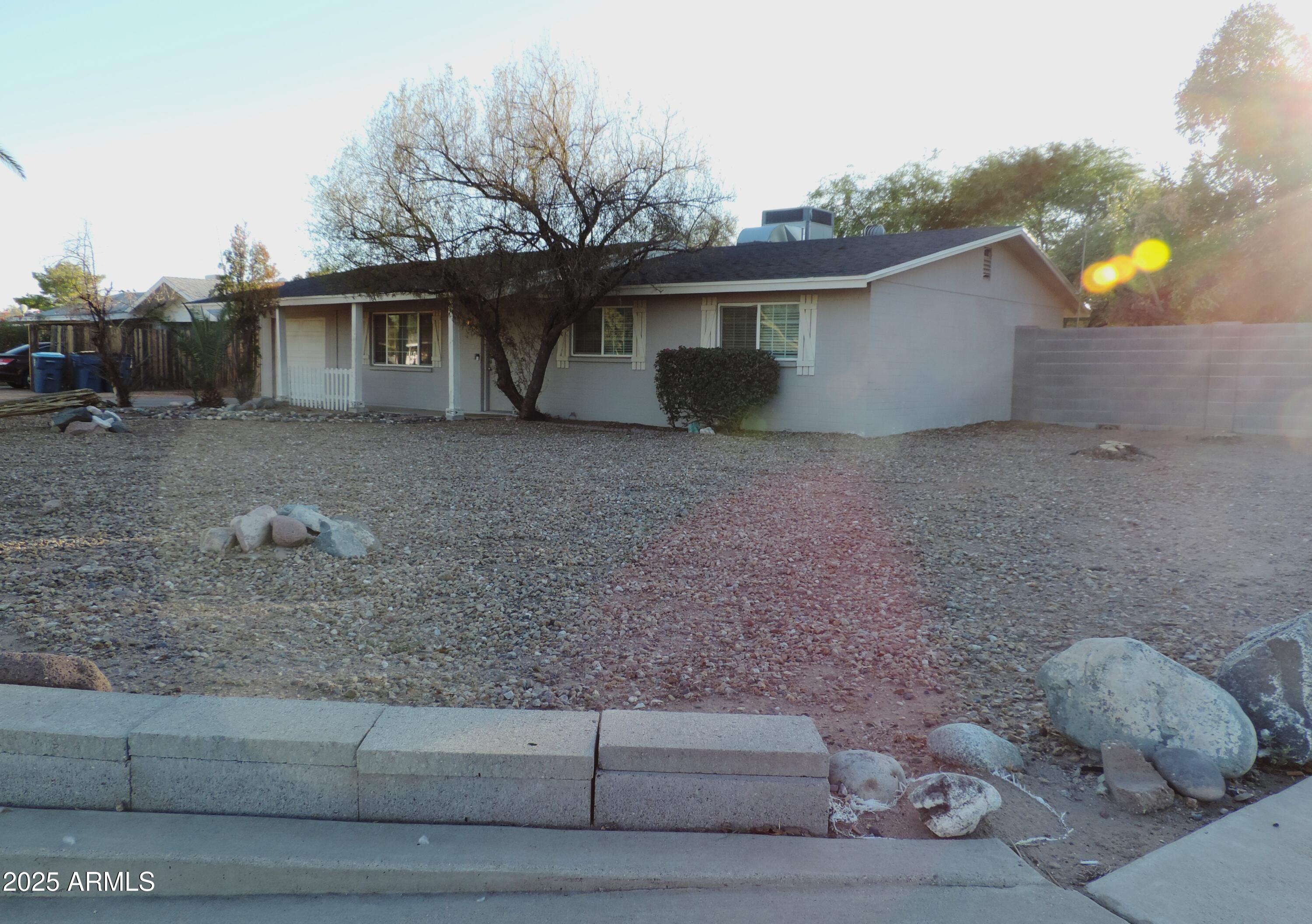 764 North Thunderbird Drive Apache Junction, AZ 85120 - Photo 63 of 74 a view of a house with a yard and a tree