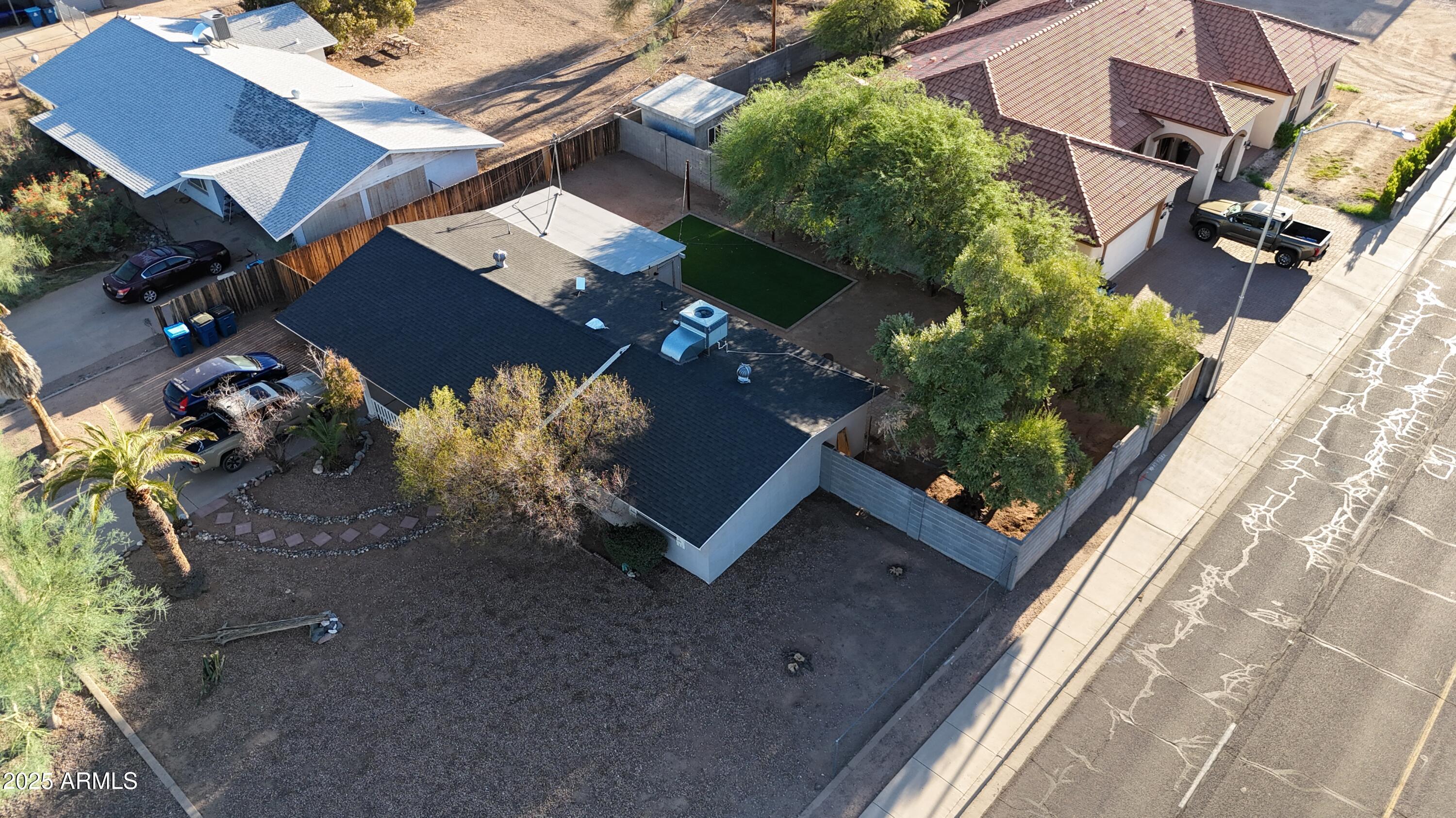 764 North Thunderbird Drive Apache Junction, AZ 85120 - Photo 72 of 74 an aerial view of a house with a yard and street