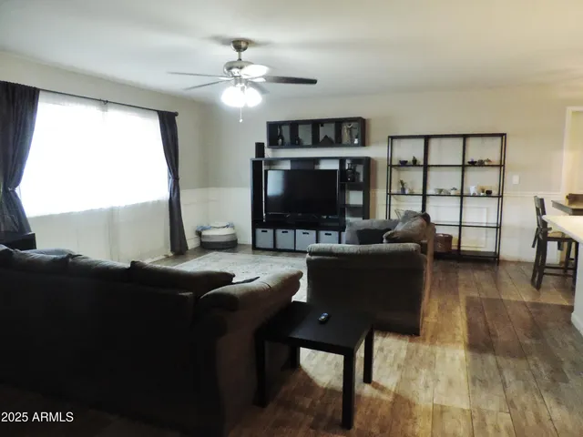 a kitchen with kitchen island a counter space a sink appliances and cabinets