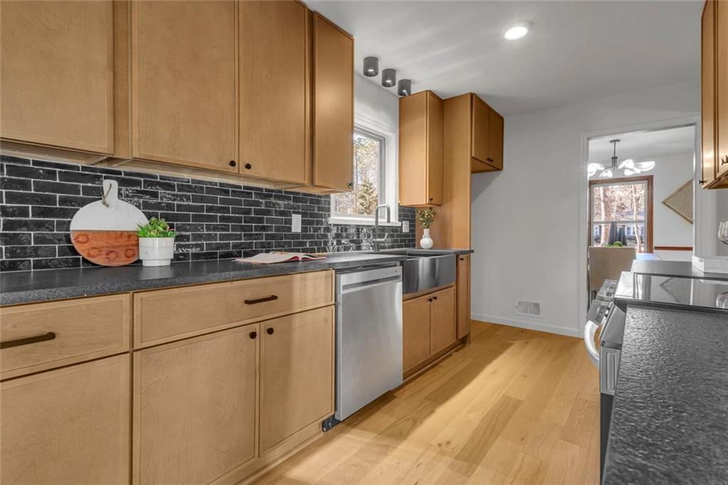 260 Devilla Trace Fayetteville, GA 30214 - Photo 14 of 47 a kitchen with a sink a stove and cabinets