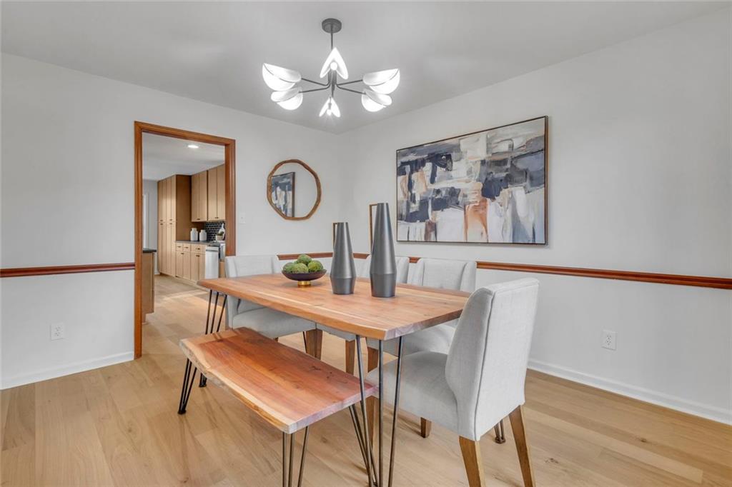 260 Devilla Trace Fayetteville, GA 30214 - Photo 19 of 47 a view of a dining room with furniture and wooden floor