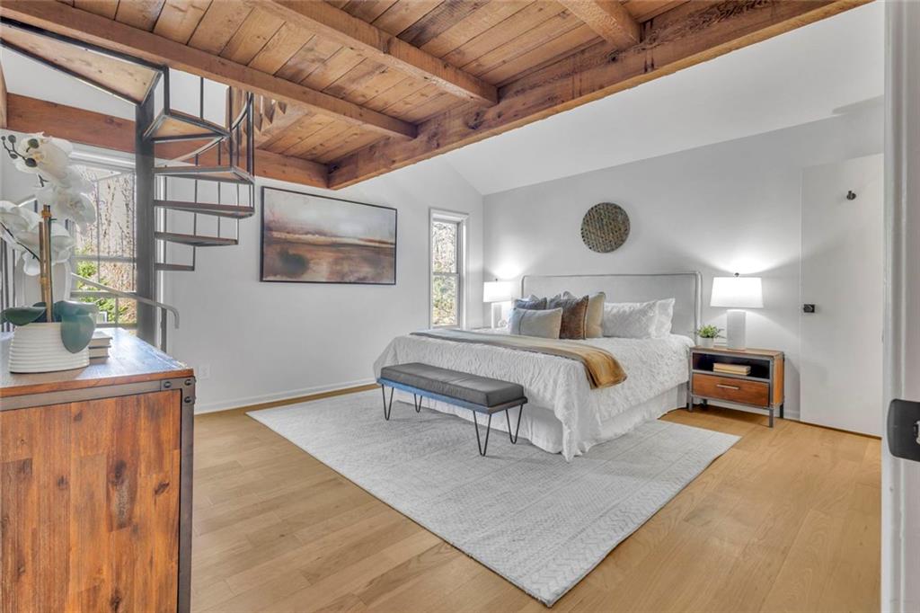 260 Devilla Trace Fayetteville, GA 30214 - Photo 21 of 47 a bedroom with a bed a table and painting on the wall