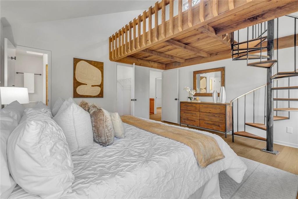 260 Devilla Trace Fayetteville, GA 30214 - Photo 23 of 47 a bedroom with a bed a chandelier and dresser