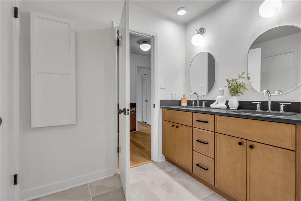 260 Devilla Trace Fayetteville, GA 30214 - Photo 30 of 47 a spacious bathroom with a double vanity sink a mirror and shower