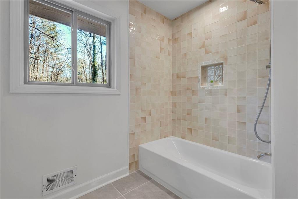 260 Devilla Trace Fayetteville, GA 30214 - Photo 31 of 47 a bathroom with a bathtub and window