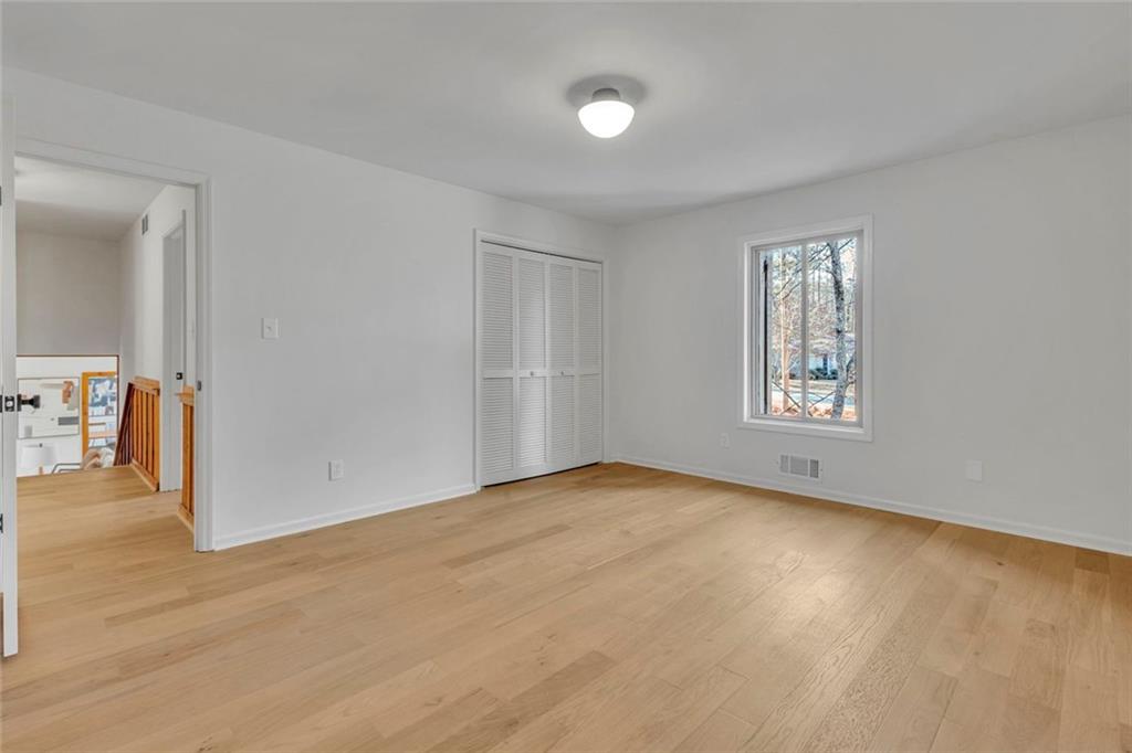 260 Devilla Trace Fayetteville, GA 30214 - Photo 34 of 47 wooden floor in an empty room with a window