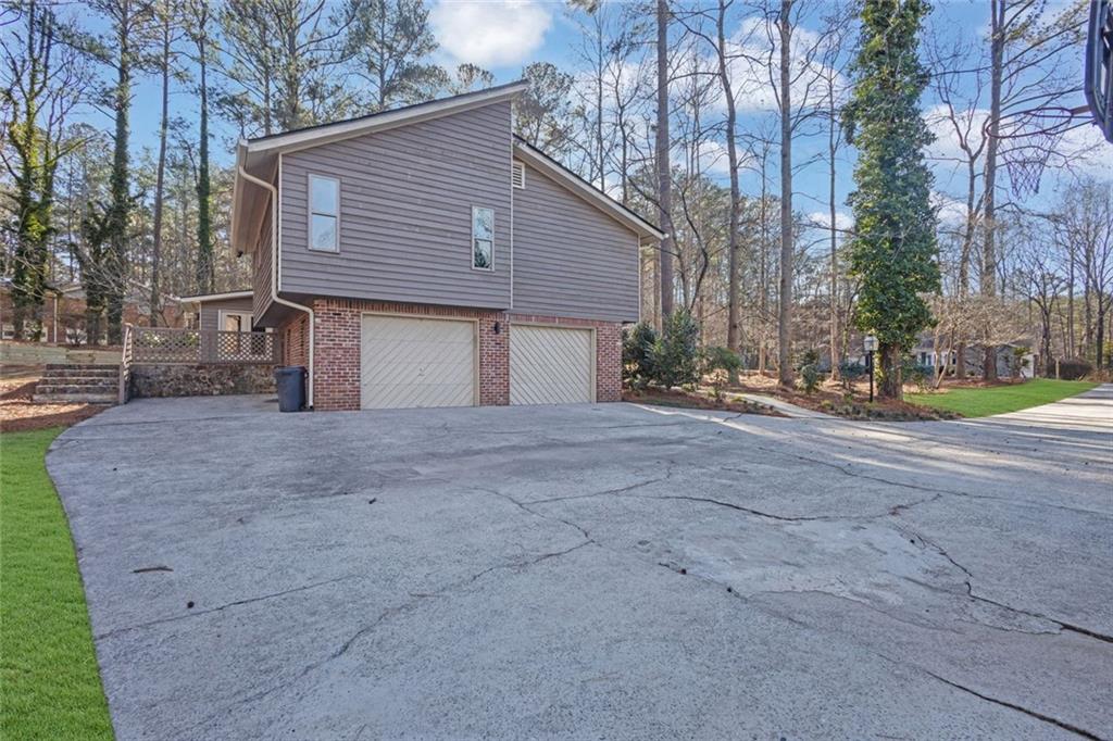 260 Devilla Trace Fayetteville, GA 30214 - Photo 40 of 47 a view of a house with a yard and garage