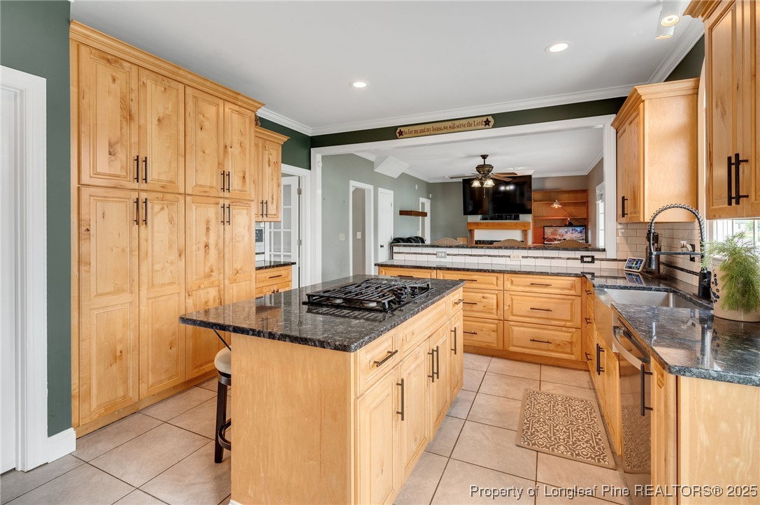 5247 Old Stage Road North Angier, NC 27501 - Photo 11 of 42 a kitchen with stainless steel appliances granite countertop a stove and a sink