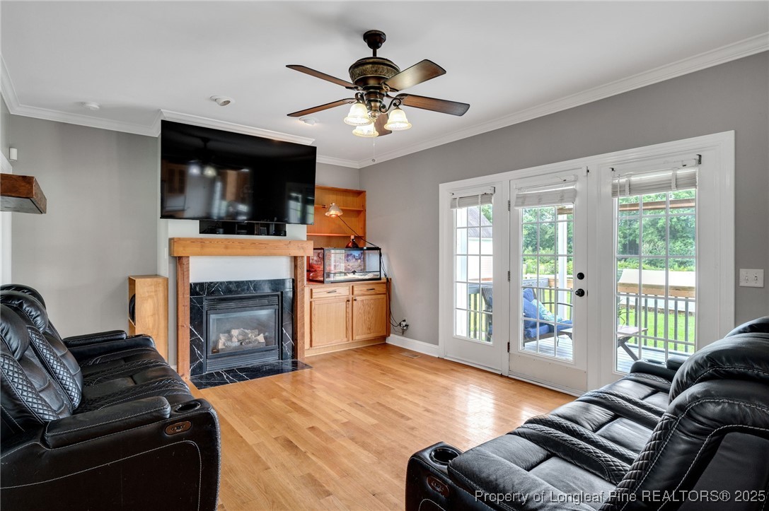 5247 Old Stage Road North Angier, NC 27501 - Photo 13 of 42 a living room with furniture fireplace and flat screen tv