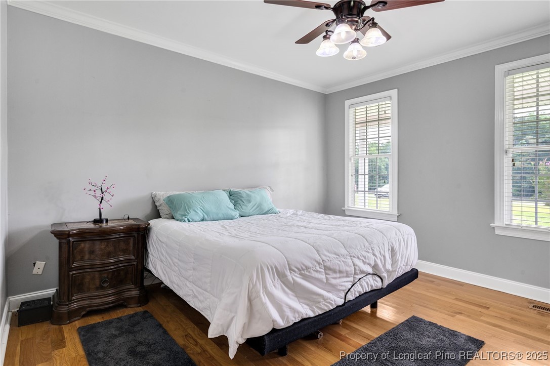 5247 Old Stage Road North Angier, NC 27501 - Photo 16 of 42 a bedroom with a bed and window