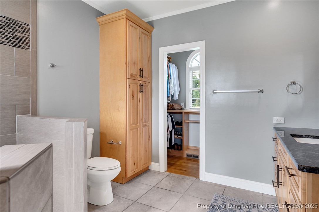 5247 Old Stage Road North Angier, NC 27501 - Photo 18 of 42 a bathroom with a toilet and a shower