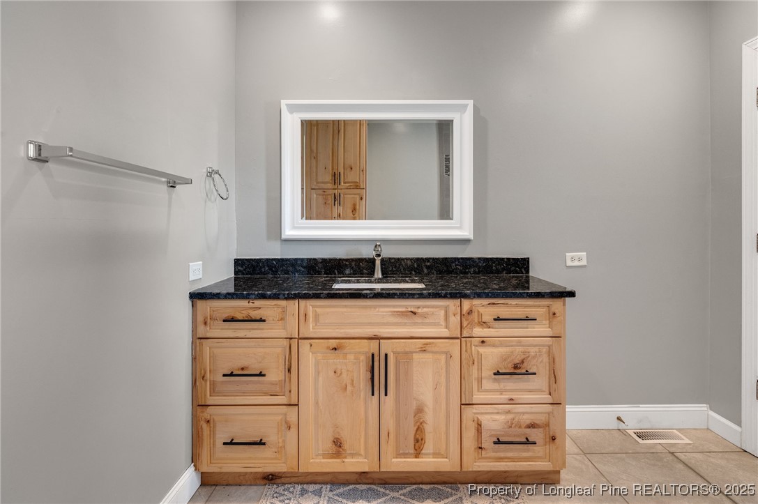 5247 Old Stage Road North Angier, NC 27501 - Photo 20 of 42 a bathroom with a sink and a mirror