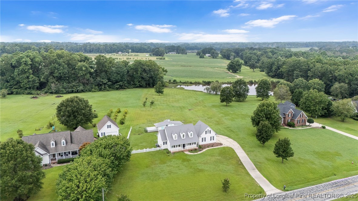 5247 Old Stage Road North Angier, NC 27501 - Photo 2 of 42 an aerial view of a house with a garden
