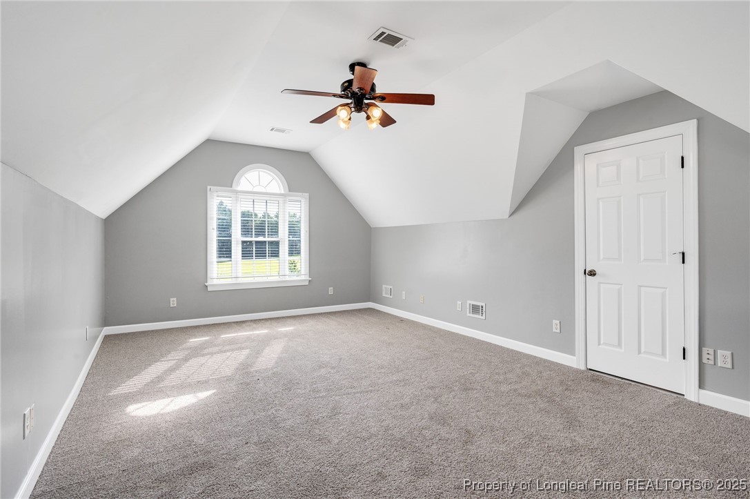 5247 Old Stage Road North Angier, NC 27501 - Photo 26 of 42 an empty room with windows and ceiling fan