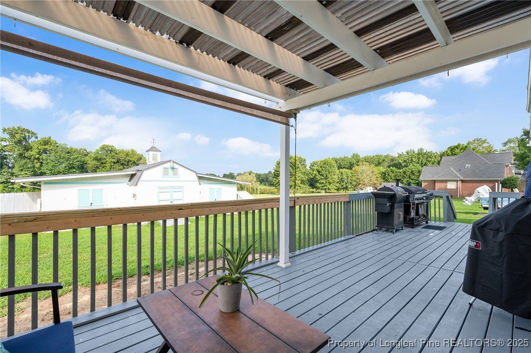 5247 Old Stage Road North Angier, NC 27501 - Photo 30 of 42 a view of a balcony with furniture