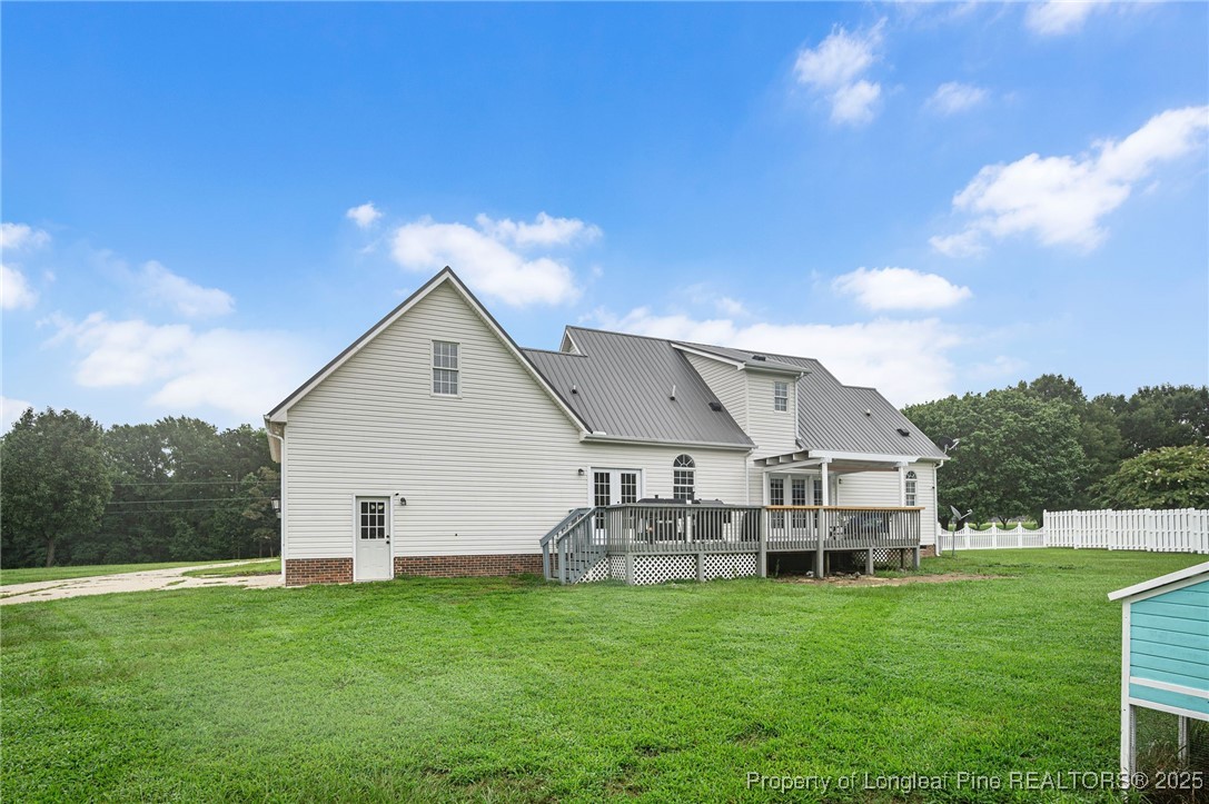 5247 Old Stage Road North Angier, NC 27501 - Photo 32 of 42 a aerial view of a house with a yard table and chairs